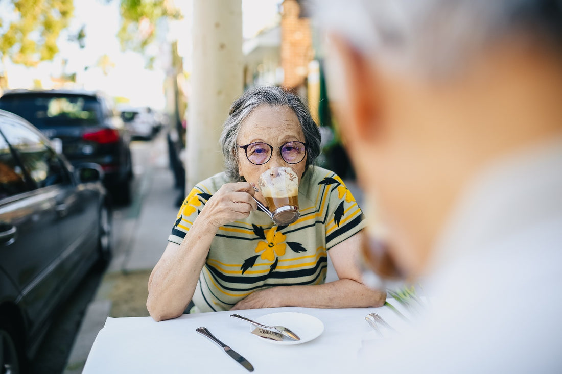 An woman drinking coffee